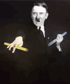 Hitler raving with a glow stick in both hand
